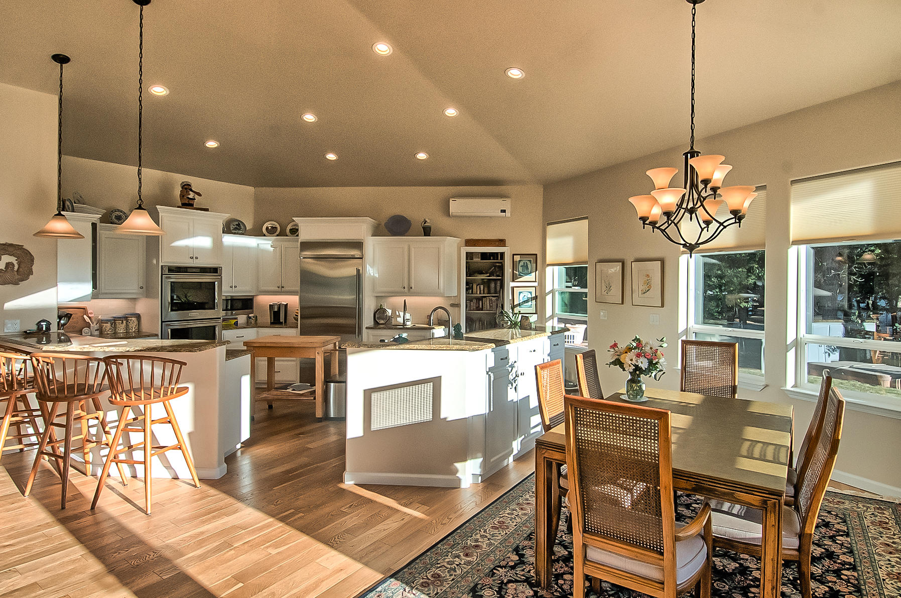 32505 Forwards Ml Road Manton, CA 96059 - Photo 44 of 70 a very nice looking open dining room with kitchen island stainless steel appliances a couch and a chandelier