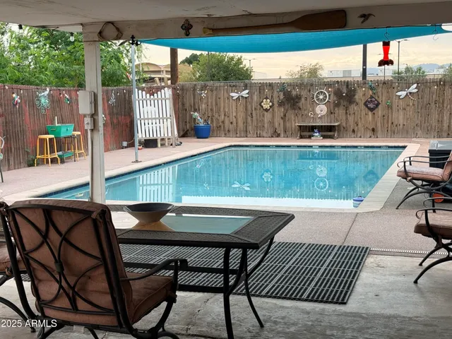 a view of backyard with seating area and furniture