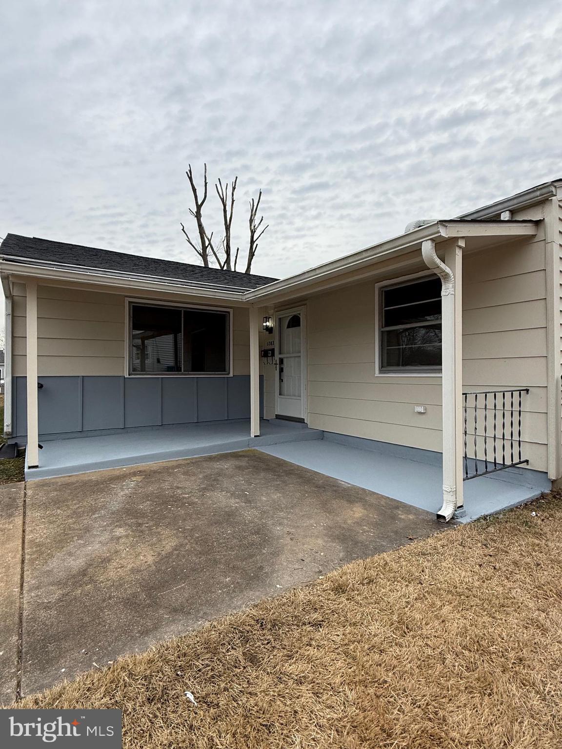 1203 Riggs Court Woodbridge, VA 22191 - Photo 11 of 39 a front view of a house with a yard and garage