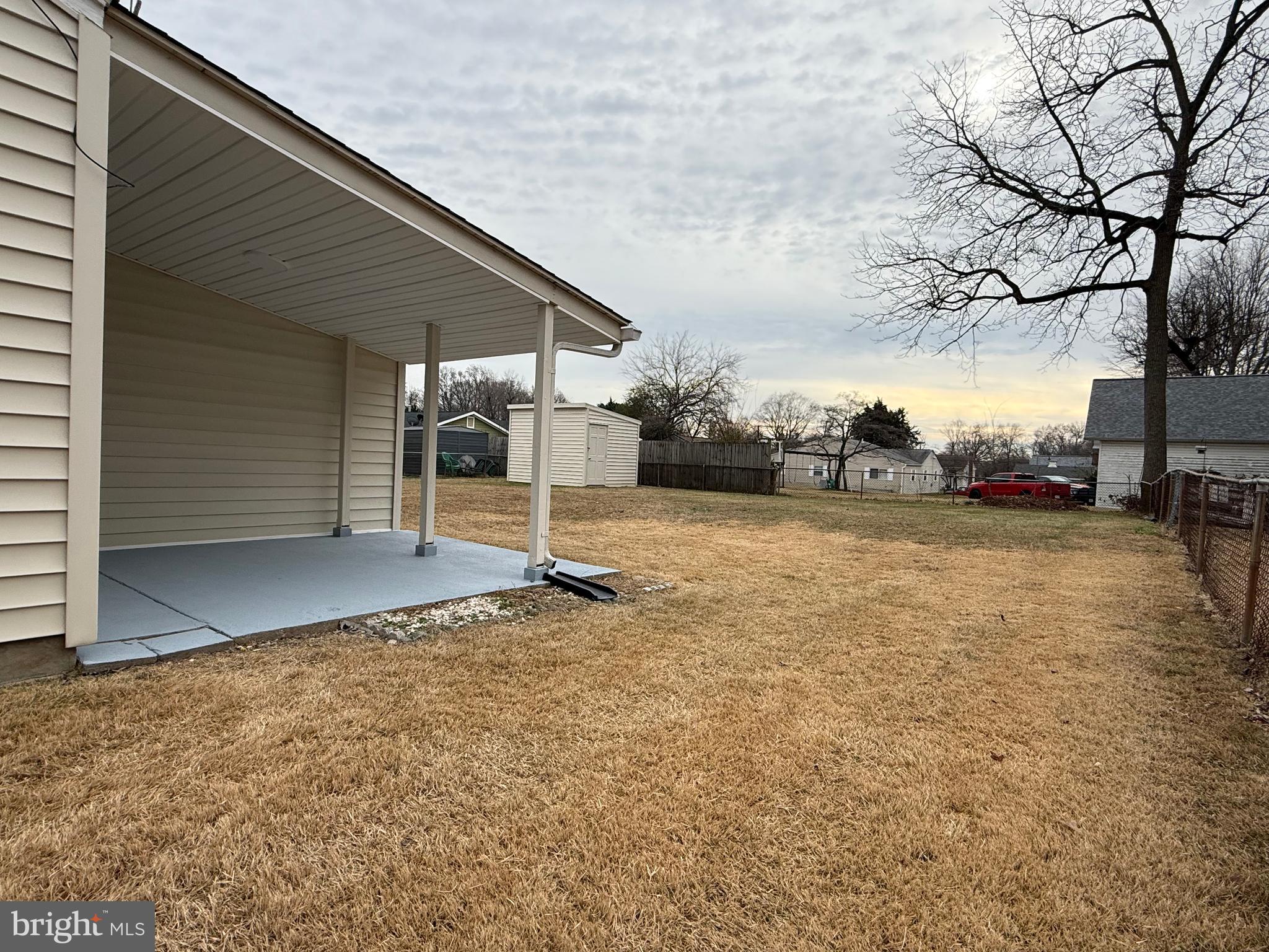 1203 Riggs Court Woodbridge, VA 22191 - Photo 12 of 39 a backyard of a house with lots of green space