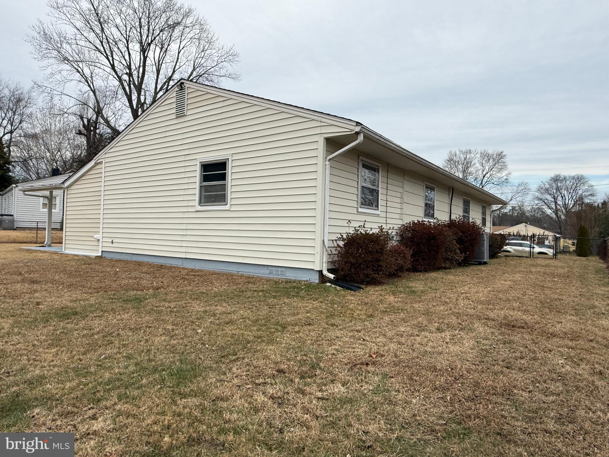 1203 Riggs Court Woodbridge, VA 22191 - Photo 15 of 39 a view of a house with a yard