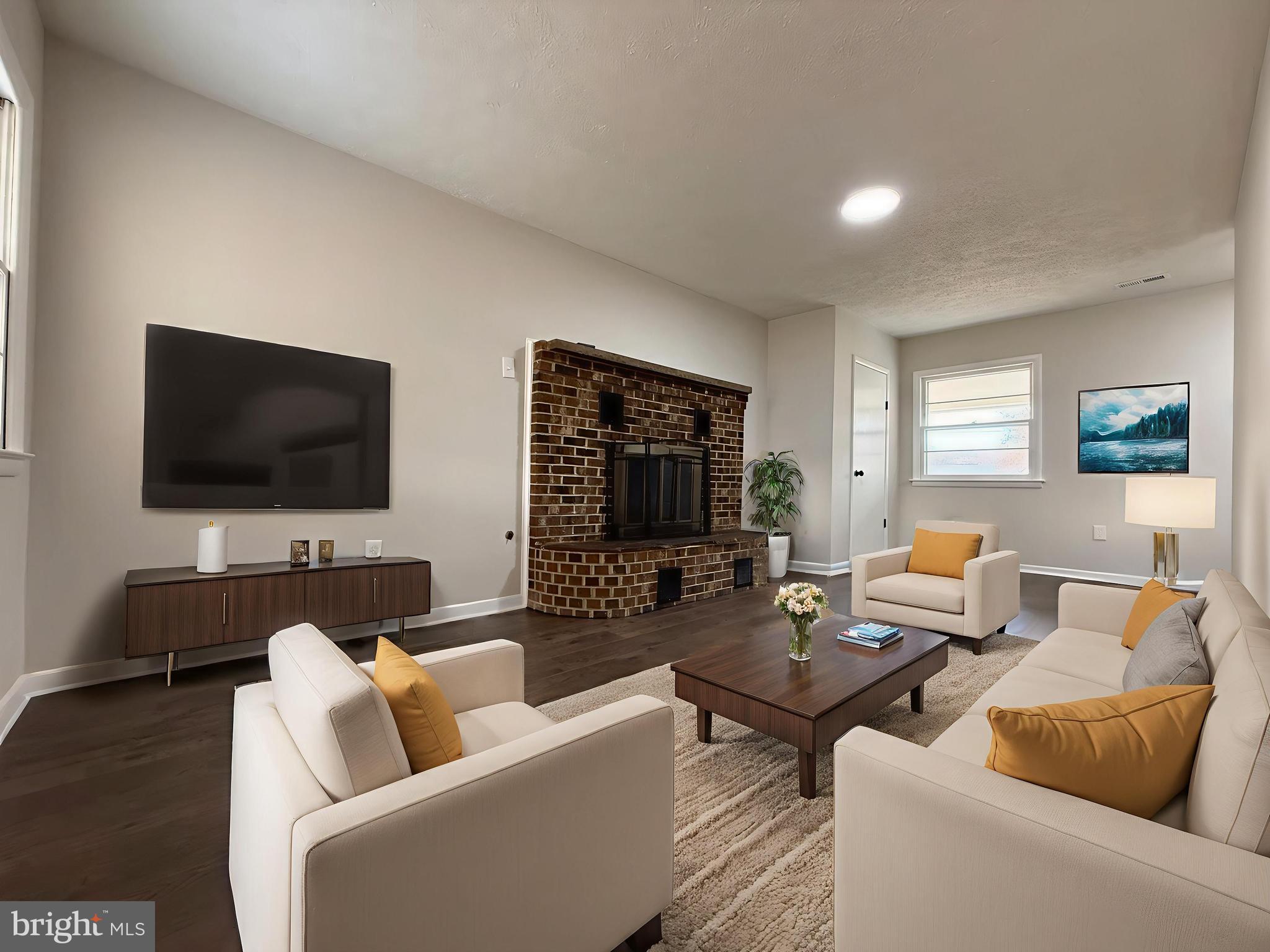 1203 Riggs Court Woodbridge, VA 22191 - Photo 29 of 39 a living room with furniture and a flat screen tv