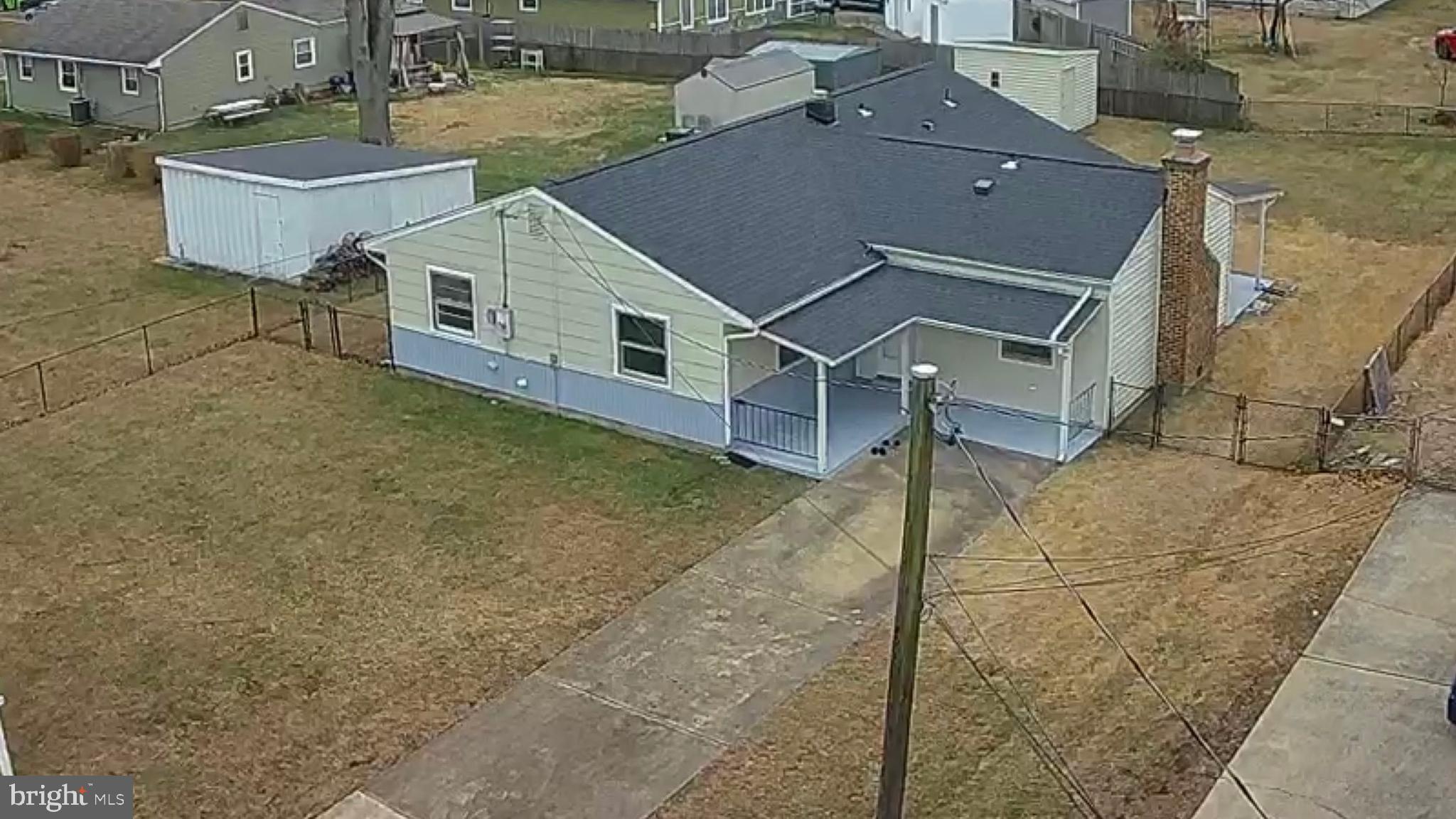1203 Riggs Court Woodbridge, VA 22191 - Photo 3 of 39 an aerial view of a house with large trees
