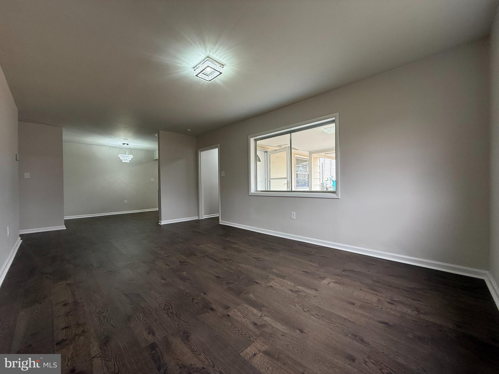 1203 Riggs Court Woodbridge, VA 22191 - Photo 31 of 39 an empty room with wooden floor and windows
