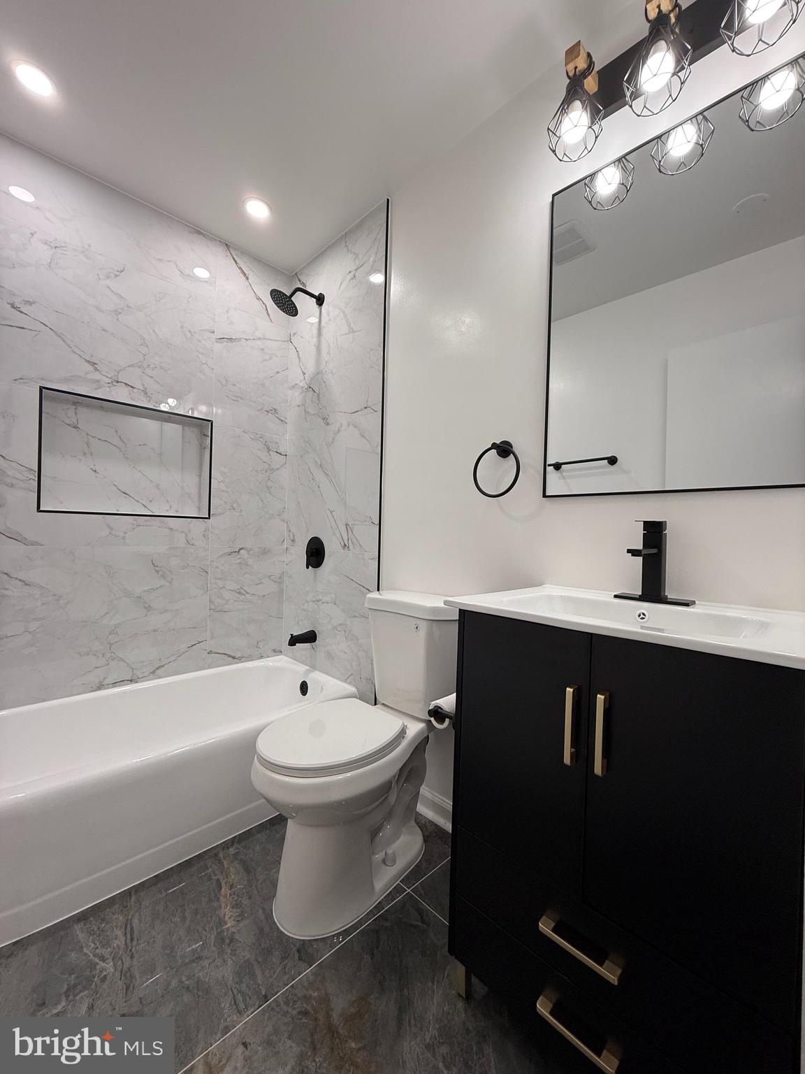 1203 Riggs Court Woodbridge, VA 22191 - Photo 33 of 39 a bathroom with a sink a toilet and shower