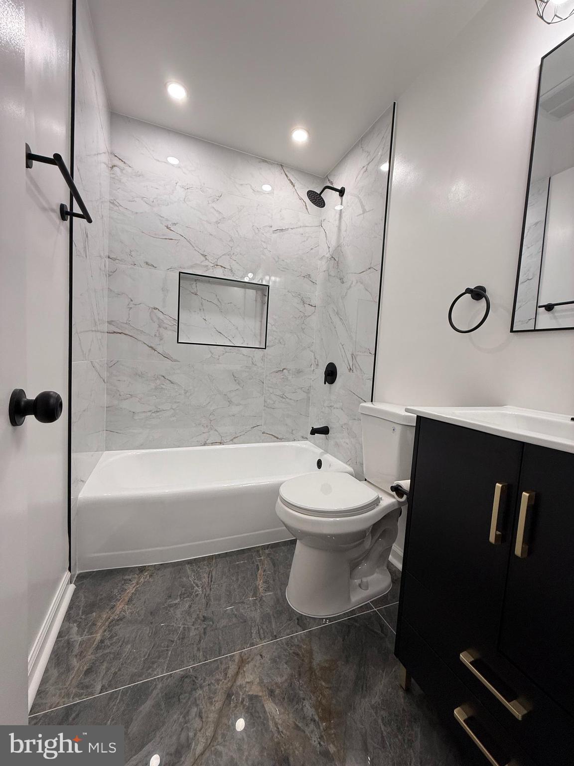 1203 Riggs Court Woodbridge, VA 22191 - Photo 34 of 39 a bathroom with a toilet a sink and a bathtub