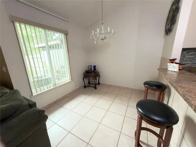 a room with furniture and a large window