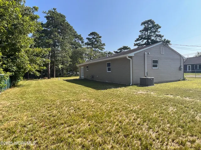 a view of a backyard of the house