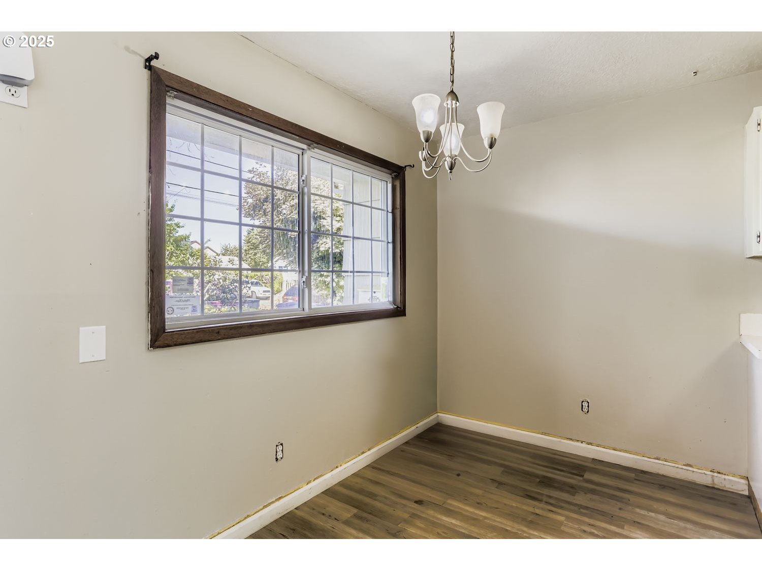 6524 Southeast 86th Avenue Portland, OR 97266 - Photo 15 of 30 en empty room with wooden floor and window