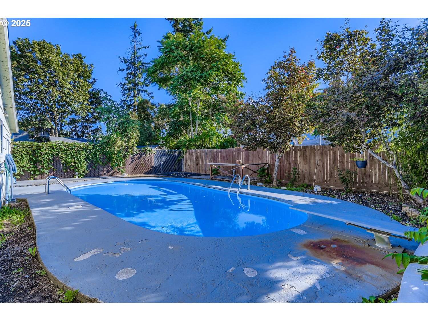 6524 Southeast 86th Avenue Portland, OR 97266 - Photo 27 of 30 a view of a swimming pool with an outdoor space and seating area