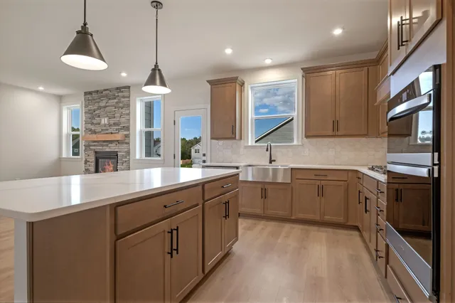 a kitchen with sink cabinets and window