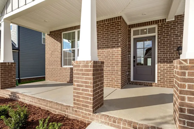 a front view of a house with a garage