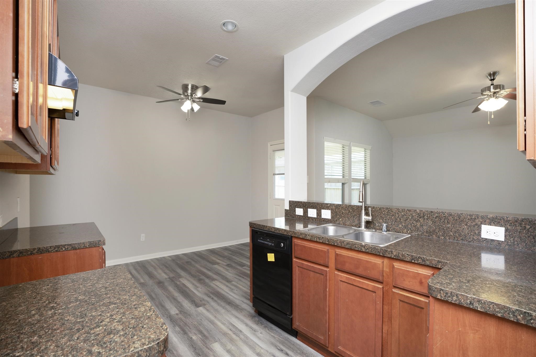 384 Decoster Boulevard Alvin, TX 77511 - Photo 12 of 27 a bathroom with a granite countertop sink a light fixture and a mirror