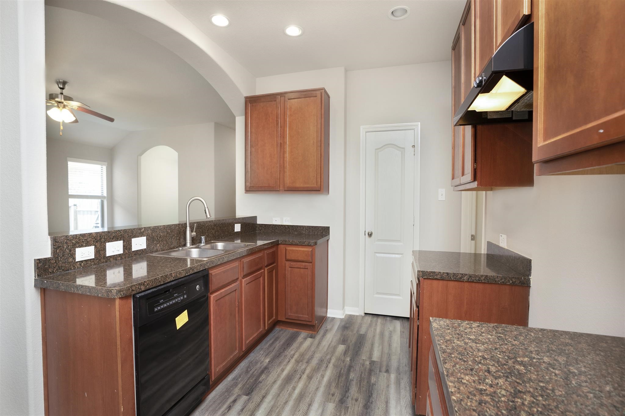 384 Decoster Boulevard Alvin, TX 77511 - Photo 13 of 27 a kitchen with sink and mirror