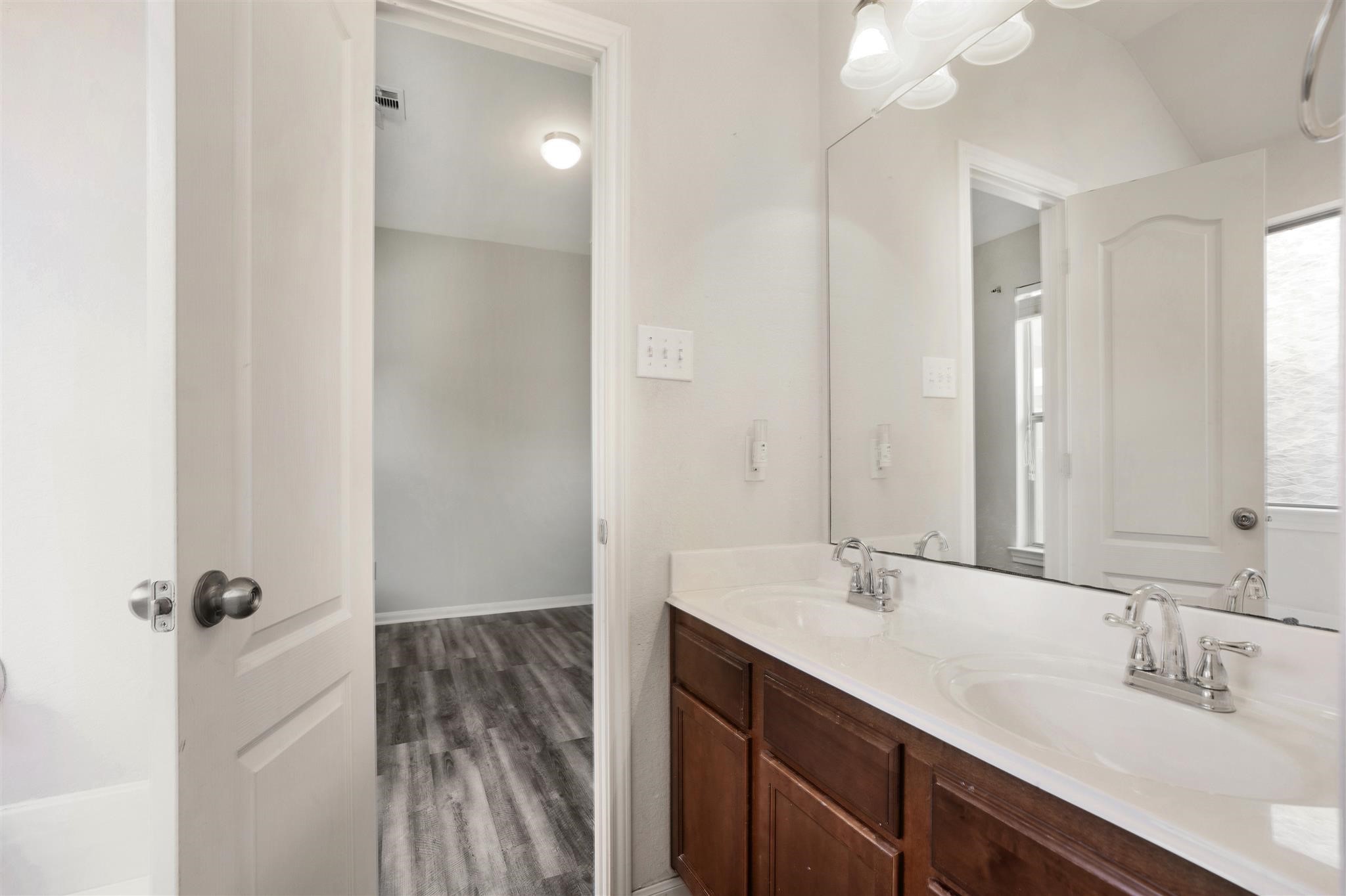 384 Decoster Boulevard Alvin, TX 77511 - Photo 20 of 27 a bathroom with a sink a toilet and shower