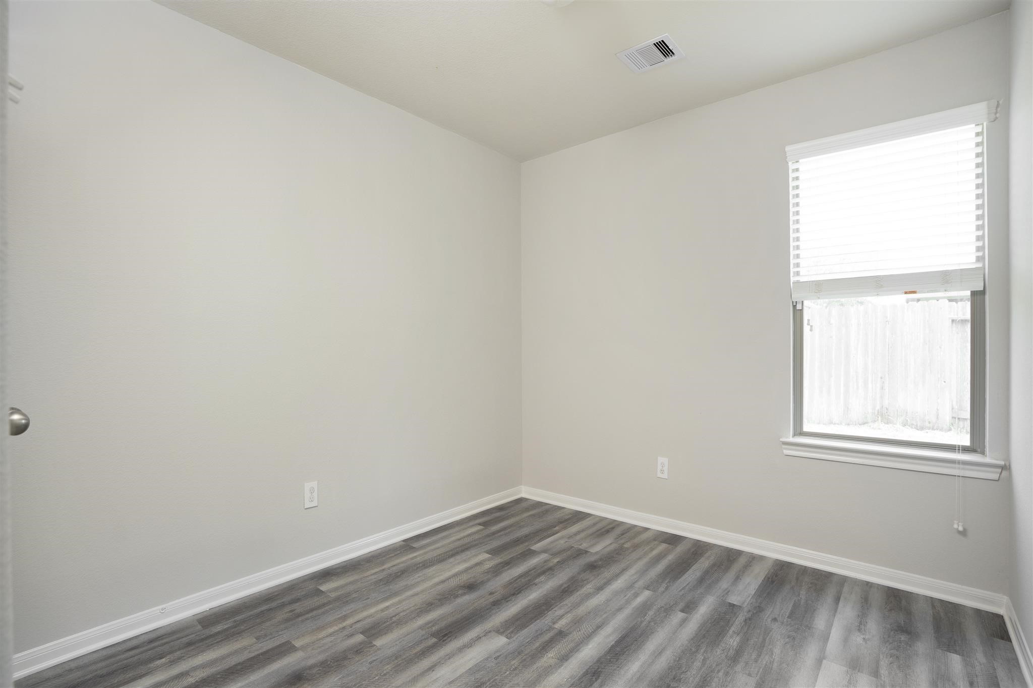 384 Decoster Boulevard Alvin, TX 77511 - Photo 23 of 27 an empty room with a window