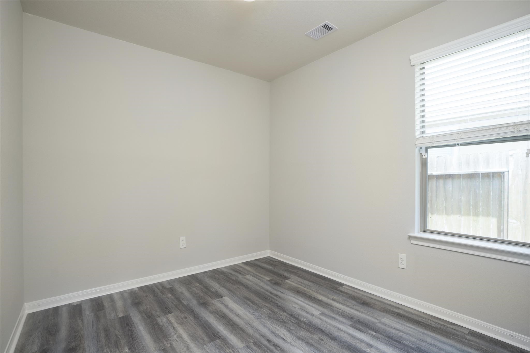 384 Decoster Boulevard Alvin, TX 77511 - Photo 24 of 27 an empty room with a window