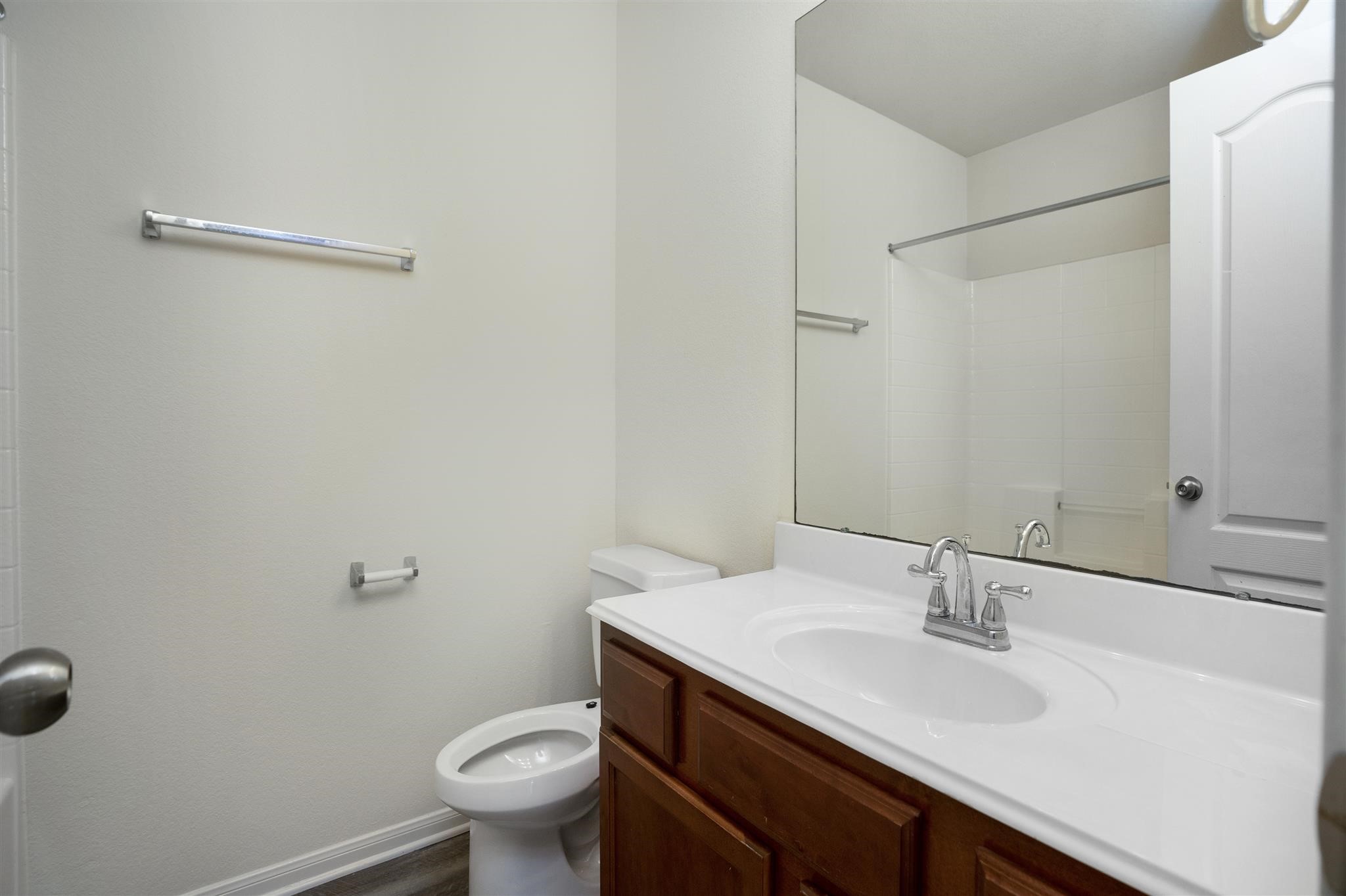 384 Decoster Boulevard Alvin, TX 77511 - Photo 25 of 27 a bathroom with a sink toilet and a mirror
