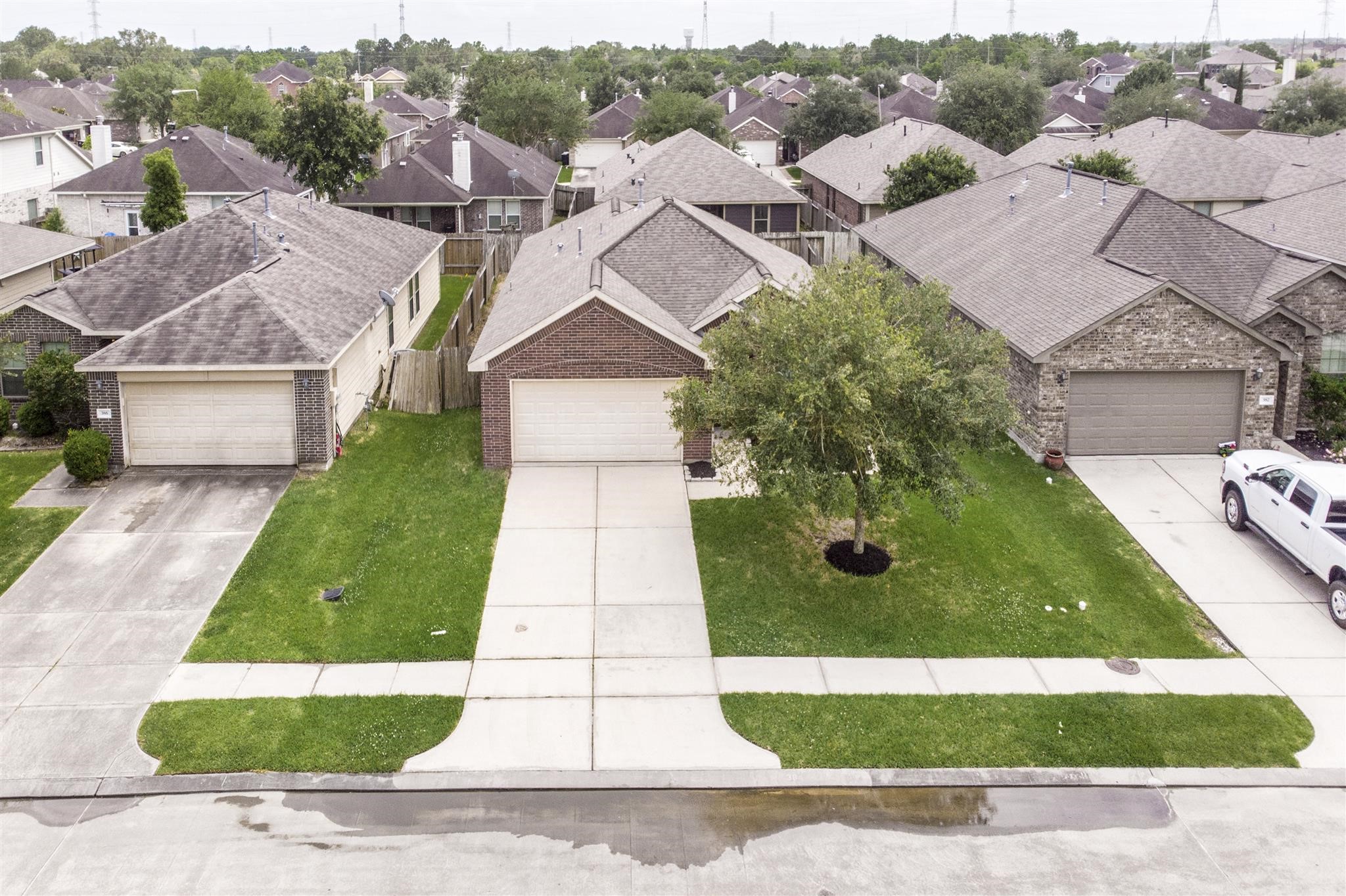 384 Decoster Boulevard Alvin, TX 77511 - Photo 3 of 27 an aerial view of a house with a yard