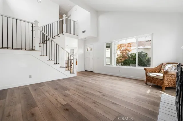 a view of livingroom with stairs and furniture