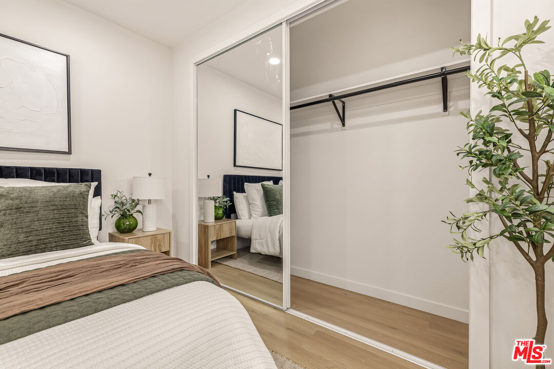 311 Bora Bora Way, Unit 3207 Marina del Rey, CA 90292 - Photo 32 of 54 a bedroom with a bed and a potted plant