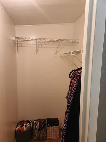 a bedroom with a bed and dresser