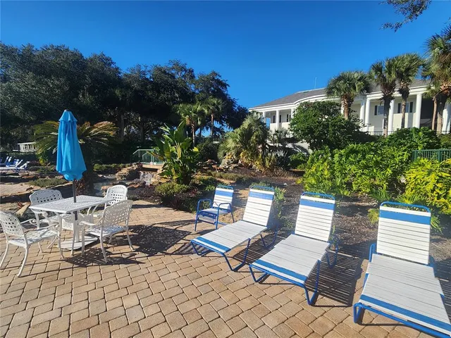 a view of outdoor space with swimming pool and sitting space