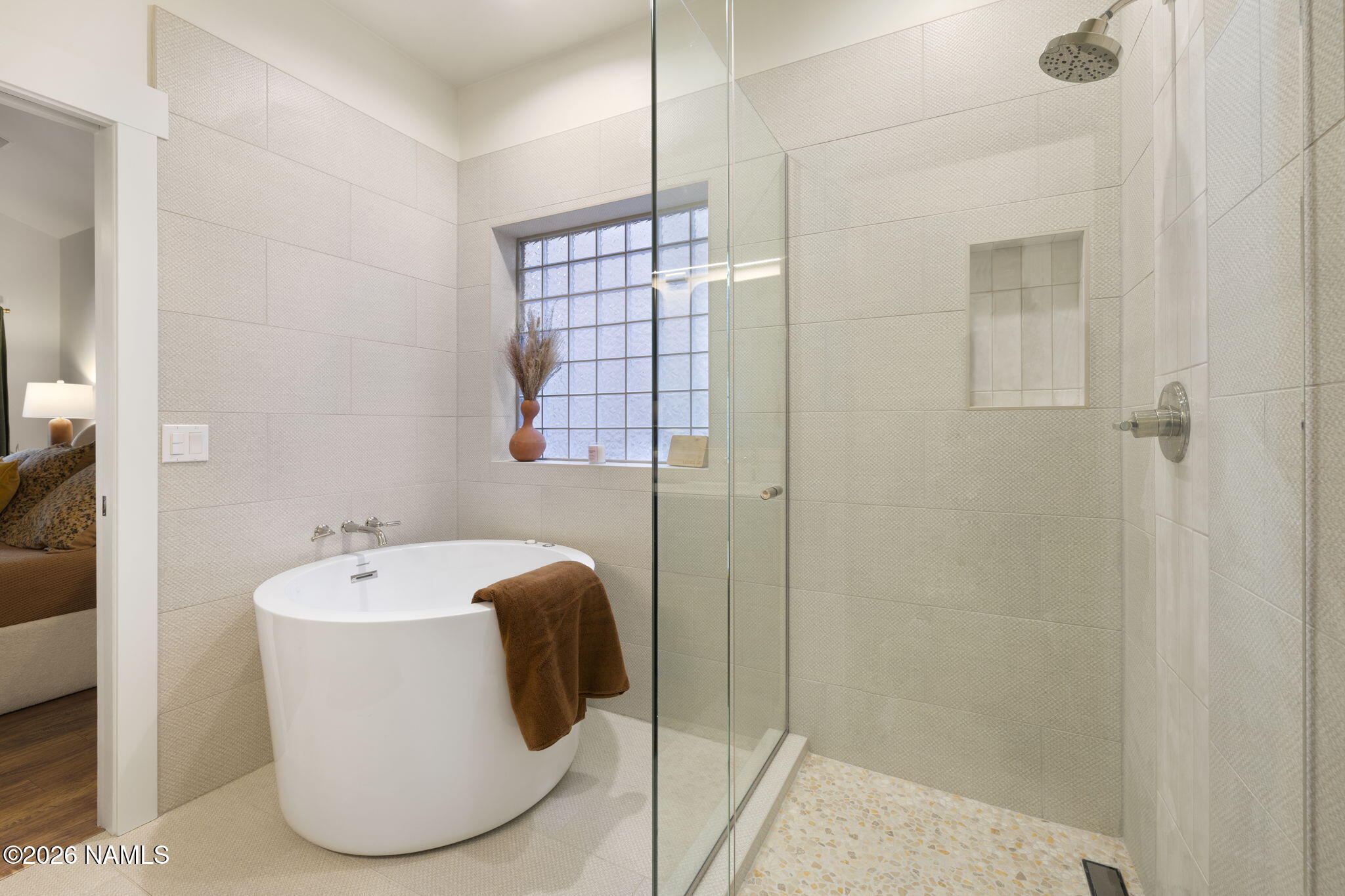 3495 West Lead Rope Flagstaff, AZ 86005 - Photo 24 of 49 a bathroom with a bathtub and shower
