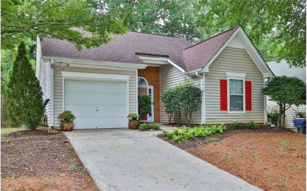 3804 Benjamin Court Southwest Atlanta, GA 30331 - Photo 2 of 13 a view of a house with a yard and large tree