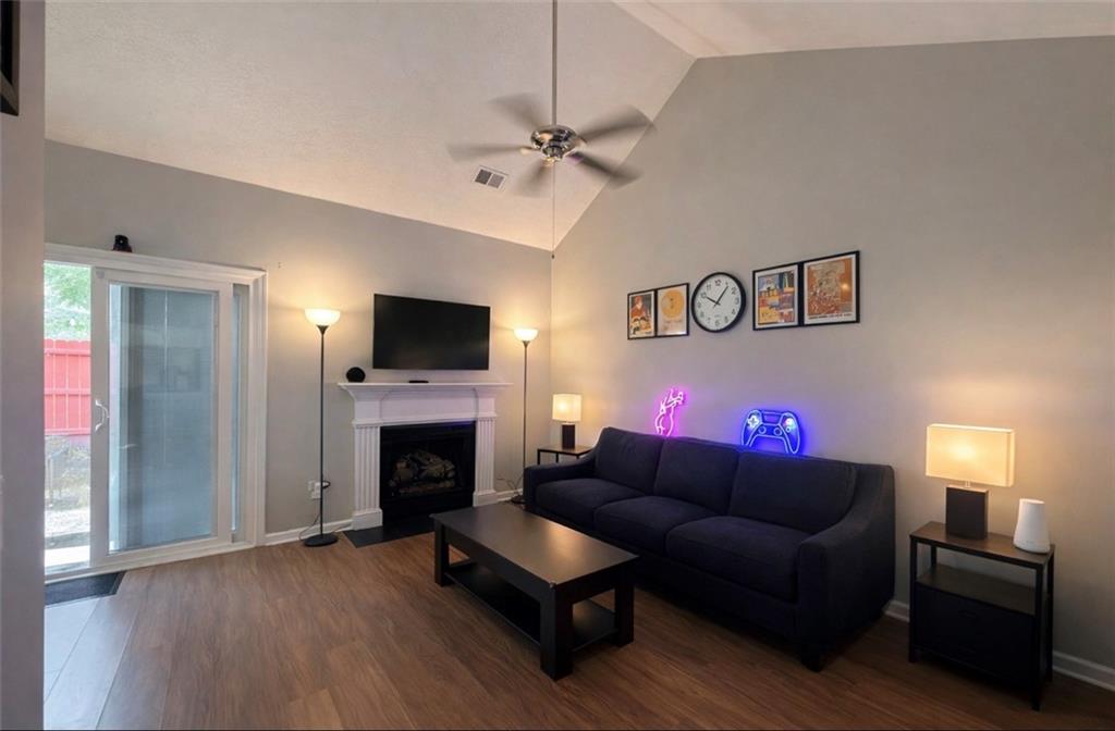 3804 Benjamin Court Southwest Atlanta, GA 30331 - Photo 6 of 13 a living room with furniture and a fireplace
