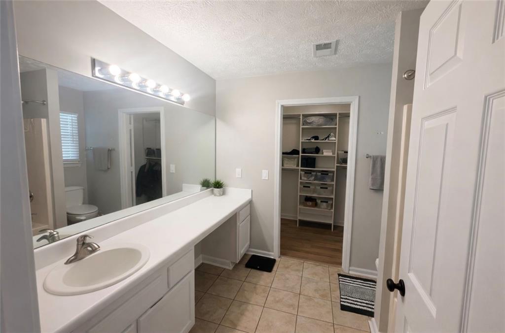3804 Benjamin Court Southwest Atlanta, GA 30331 - Photo 9 of 13 a bathroom with a sink double vanity and a mirror
