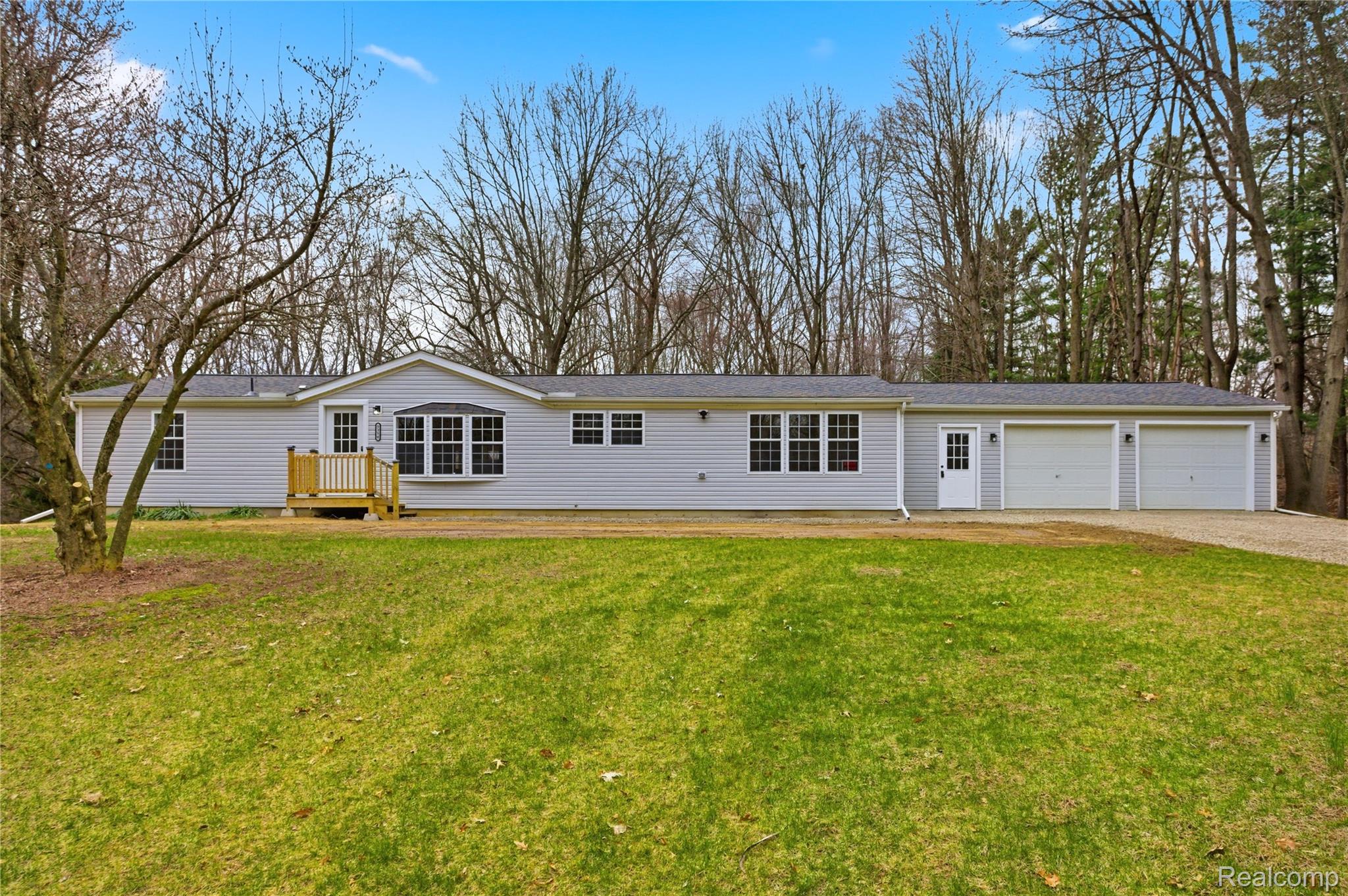 5350 List Road Grass Lake, MI 49240 - Photo 47 of 71 Ranch-style home featuring a front yard, driveway, and a garage
