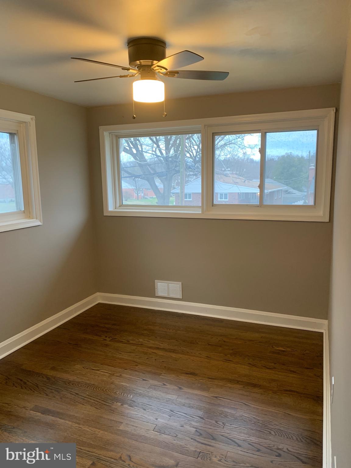 28 Othoridge Road Lutherville-Timonium, MD 21093 - Photo 12 of 27 a view of an empty room with wooden floor and a window
