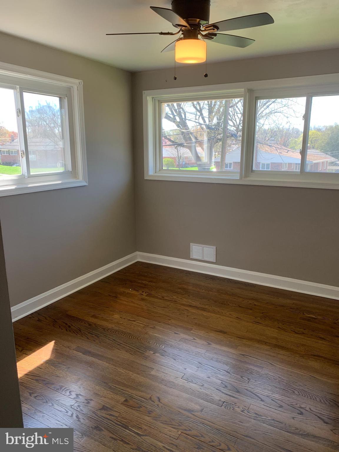 28 Othoridge Road Lutherville-Timonium, MD 21093 - Photo 14 of 27 a view of empty room with wooden floor and fan