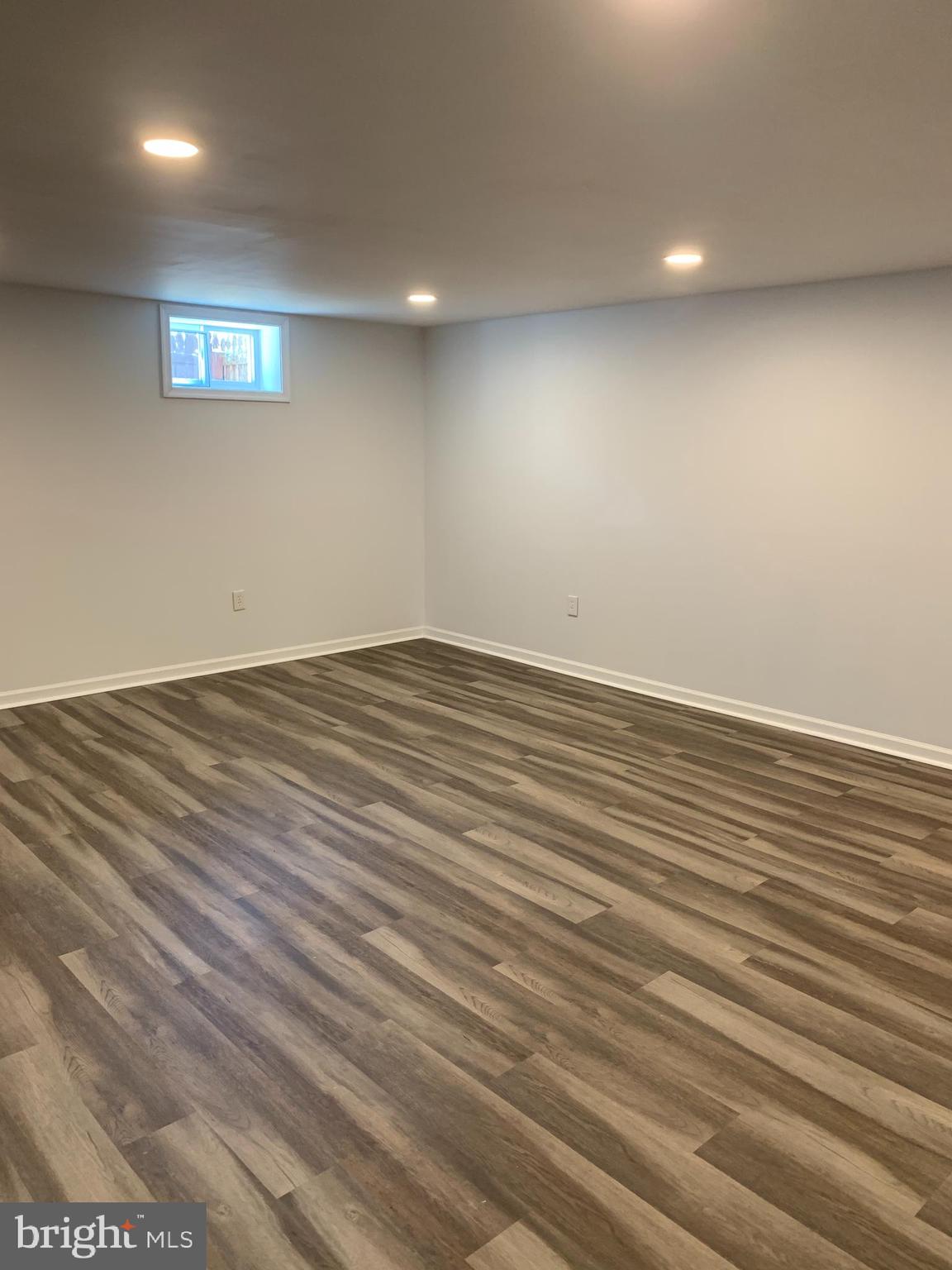 28 Othoridge Road Lutherville-Timonium, MD 21093 - Photo 17 of 27 an empty room with wooden floor and windows