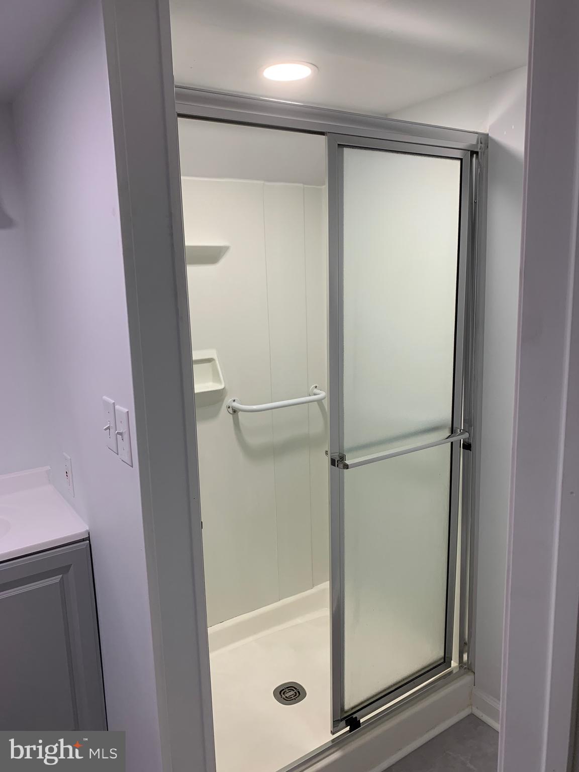 28 Othoridge Road Lutherville-Timonium, MD 21093 - Photo 21 of 27 a bathroom with a glass shower door