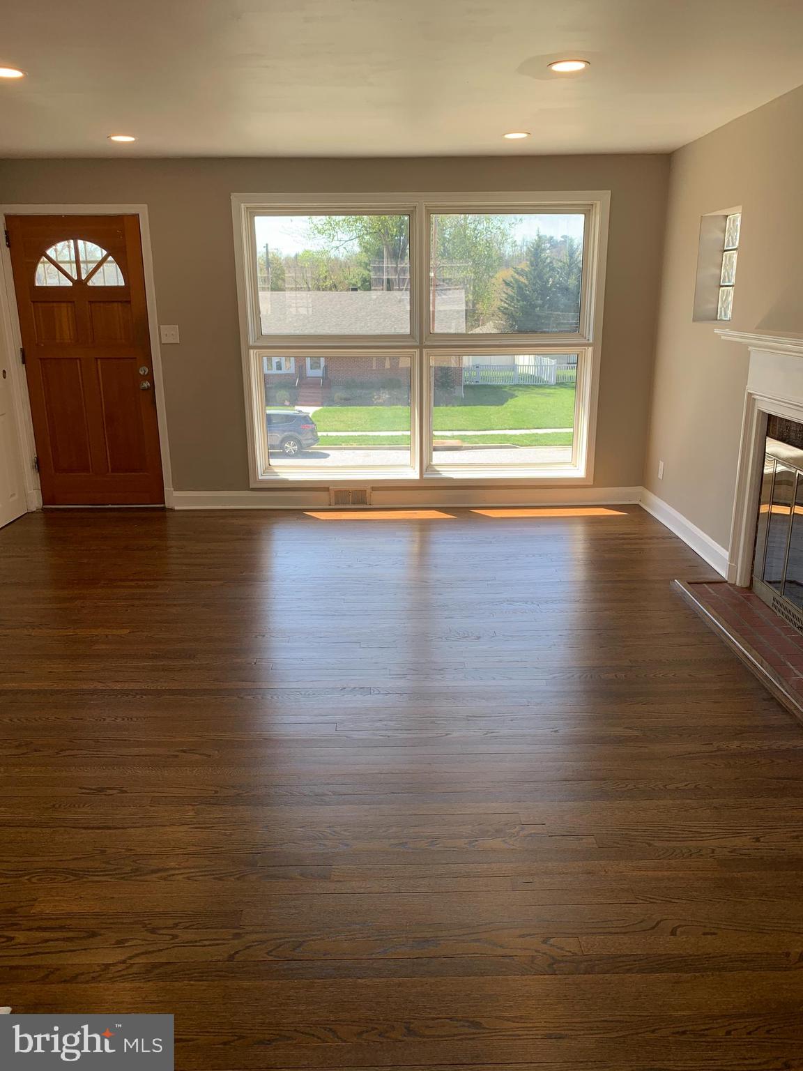 28 Othoridge Road Lutherville-Timonium, MD 21093 - Photo 3 of 27 an empty room with wooden floor and windows