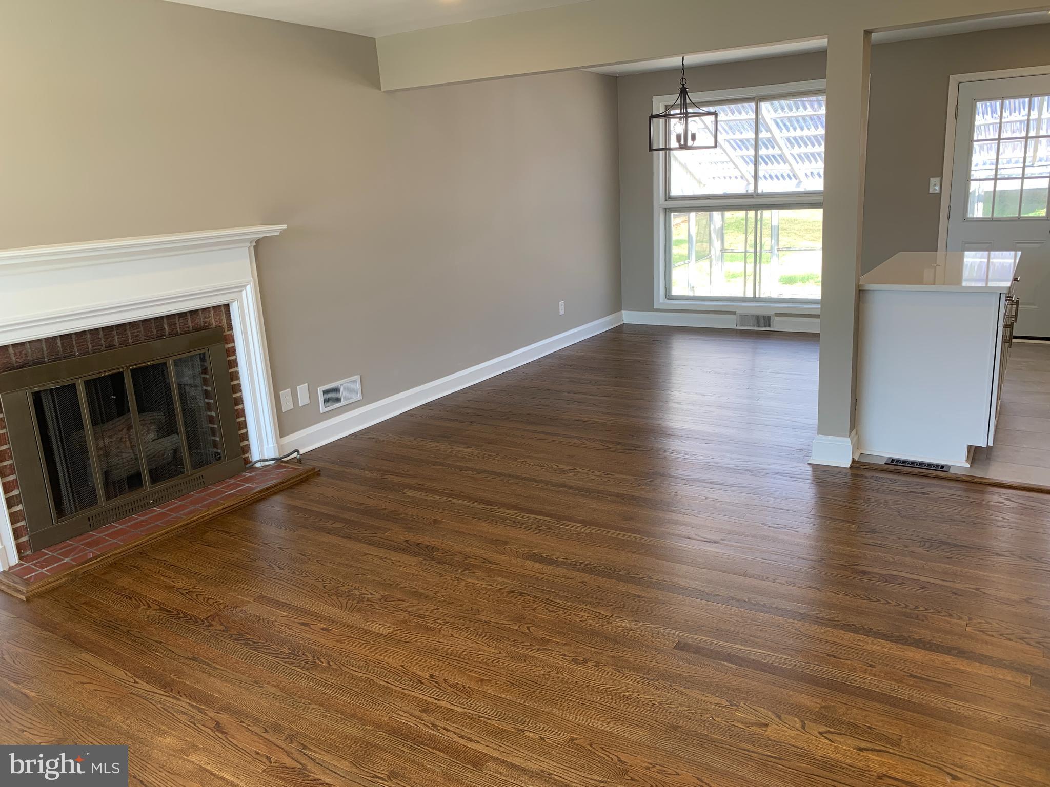 28 Othoridge Road Lutherville-Timonium, MD 21093 - Photo 4 of 27 an empty room with wooden floor and fireplace