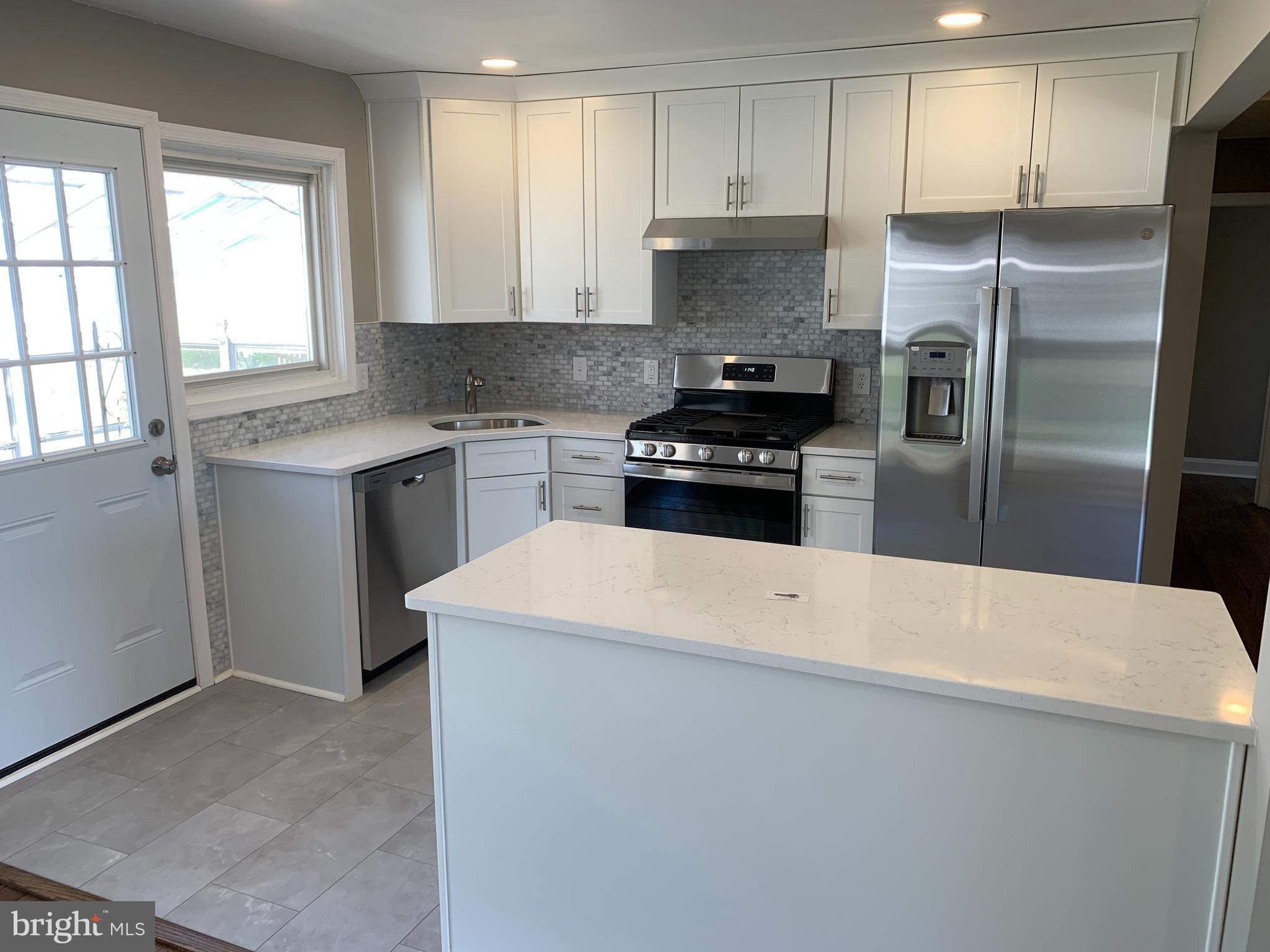 28 Othoridge Road Lutherville-Timonium, MD 21093 - Photo 5 of 27 a kitchen with a refrigerator stove and sink