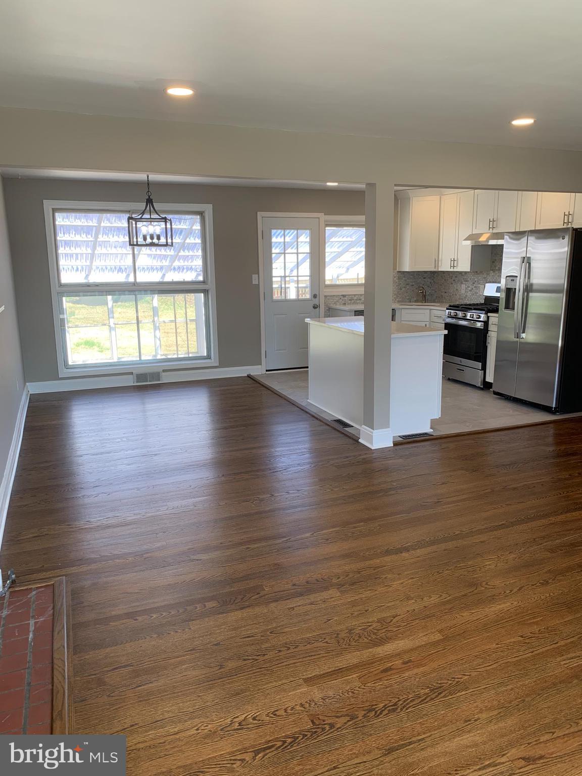 28 Othoridge Road Lutherville-Timonium, MD 21093 - Photo 6 of 27 an empty room with wooden floor and outdoor view