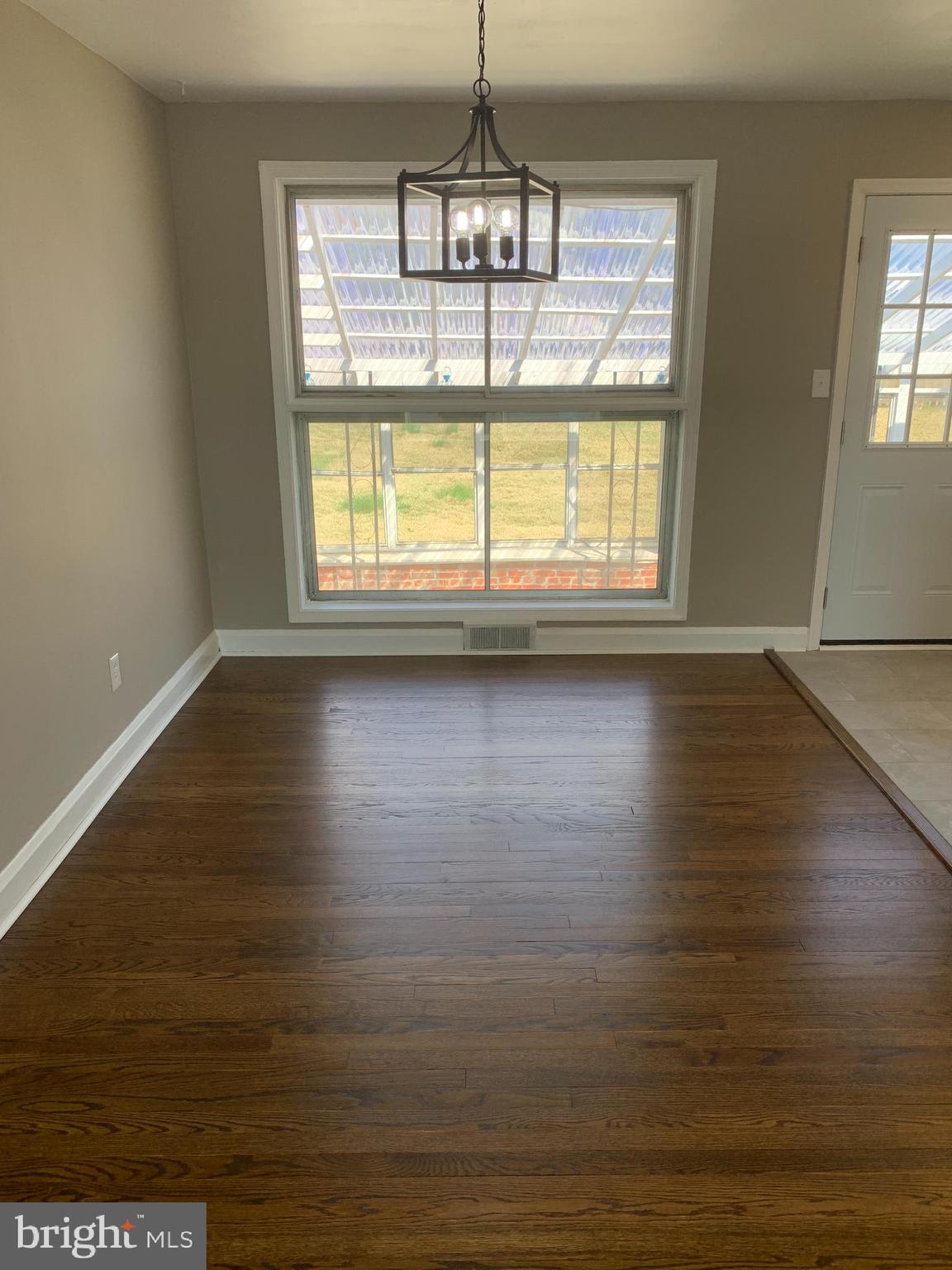 28 Othoridge Road Lutherville-Timonium, MD 21093 - Photo 7 of 27 a view of an empty room with wooden floor and a window