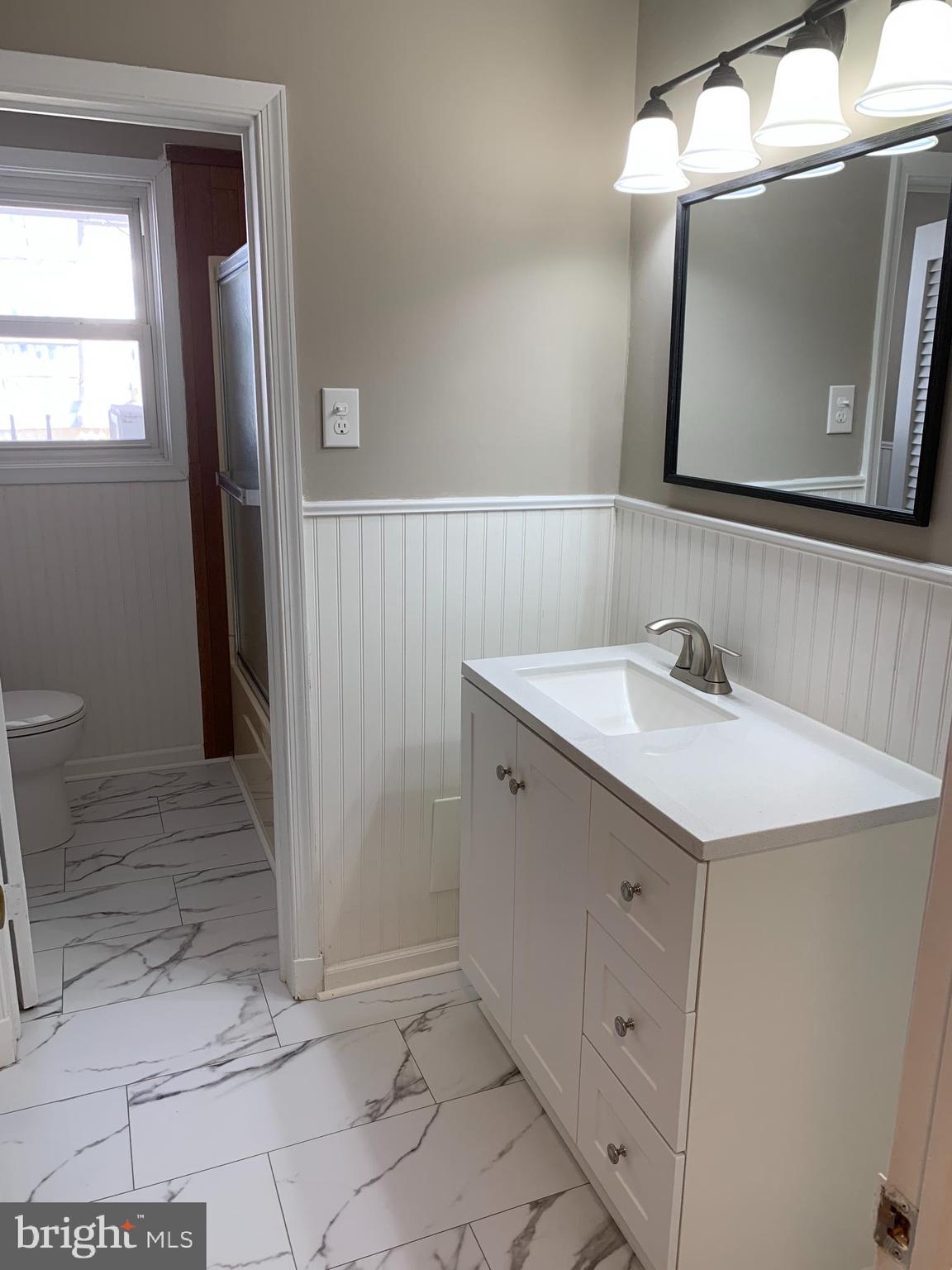 28 Othoridge Road Lutherville-Timonium, MD 21093 - Photo 8 of 27 a bathroom with a sink a toilet and mirror