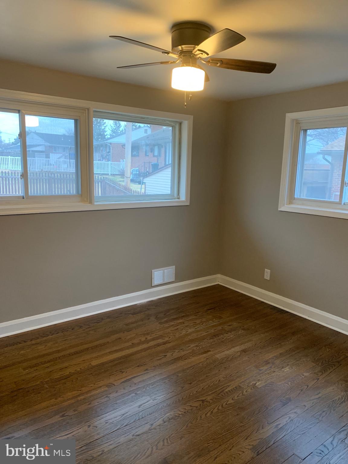 28 Othoridge Road Lutherville-Timonium, MD 21093 - Photo 10 of 27 a view of an empty room with wooden floor and a window