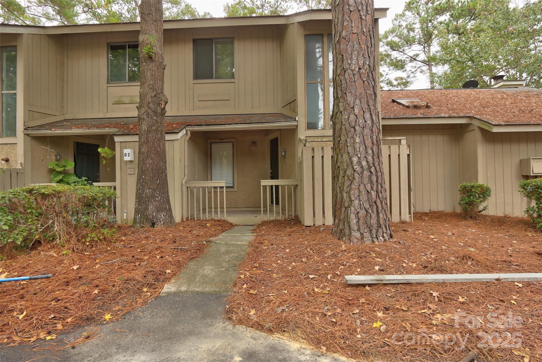 5 Gumtree Road, Unit D3 Hilton Head Island, SC 29926 - Photo 1 of 17 a front view of a house with a garage