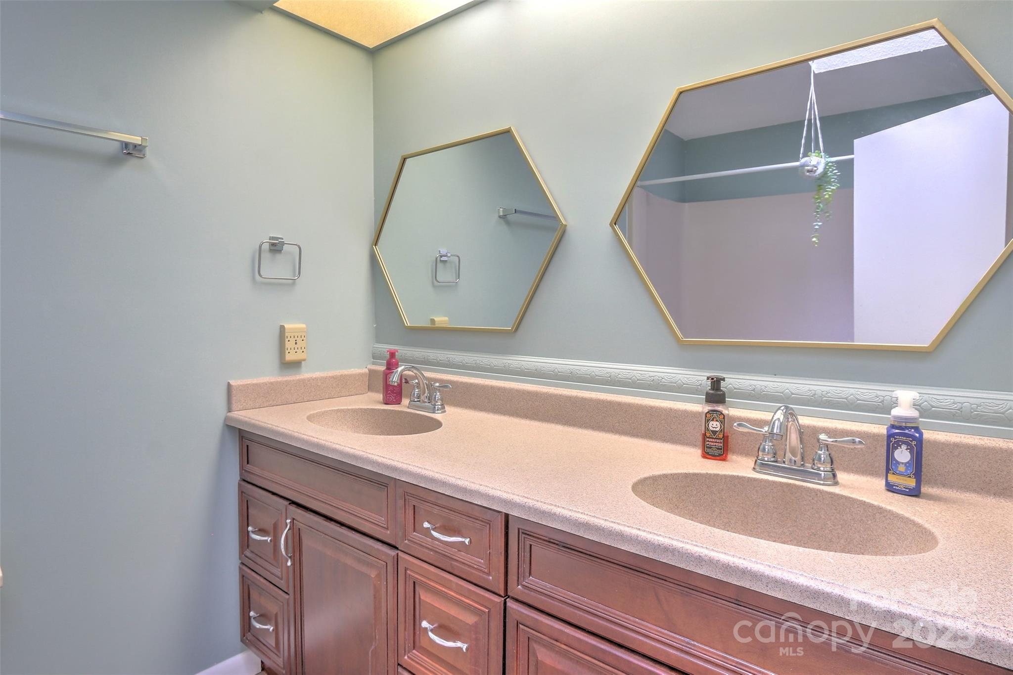 5 Gumtree Road, Unit D3 Hilton Head Island, SC 29926 - Photo 14 of 17 a bathroom with a sink and a mirror