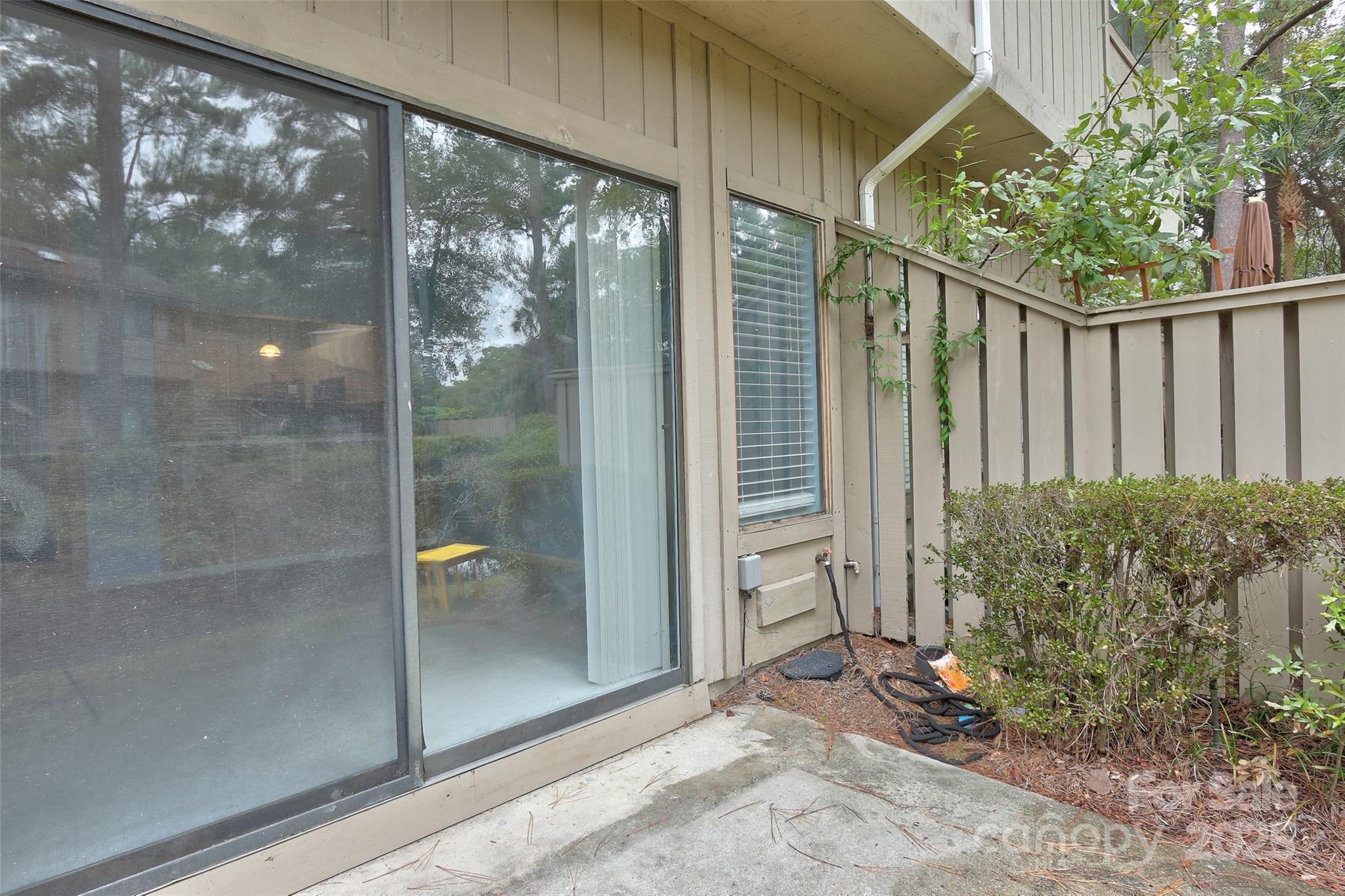 5 Gumtree Road, Unit D3 Hilton Head Island, SC 29926 - Photo 15 of 17 a view of a glass door and porch