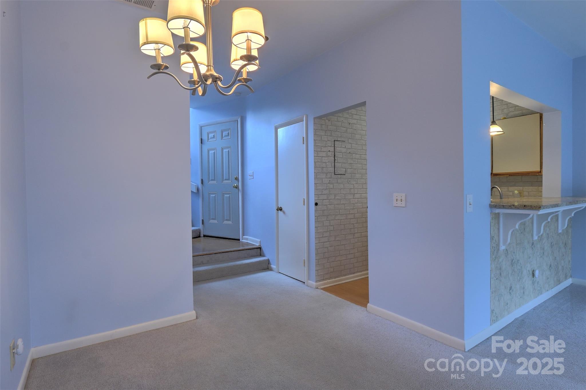 5 Gumtree Road, Unit D3 Hilton Head Island, SC 29926 - Photo 5 of 17 a view of a hallway with a chandelier
