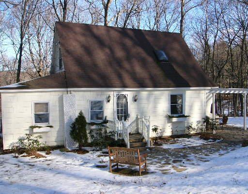 11 Overlook Knoll Road Newtown, CT 06482 - Photo 1 of 1 a front view of a house with garden