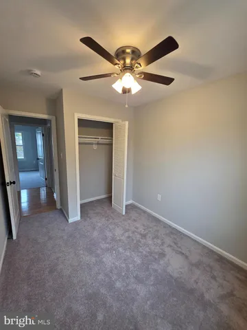 a view of gallery with wooden floor