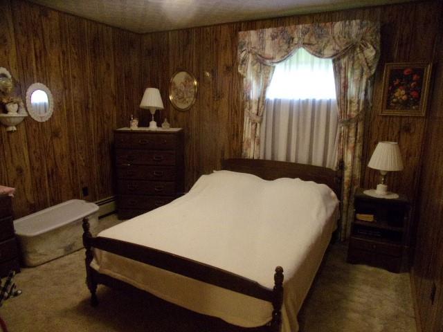533 Acme Street Rimersburg, PA 16248 - Photo 8 of 26 a bedroom with a bed and dresser with mirror